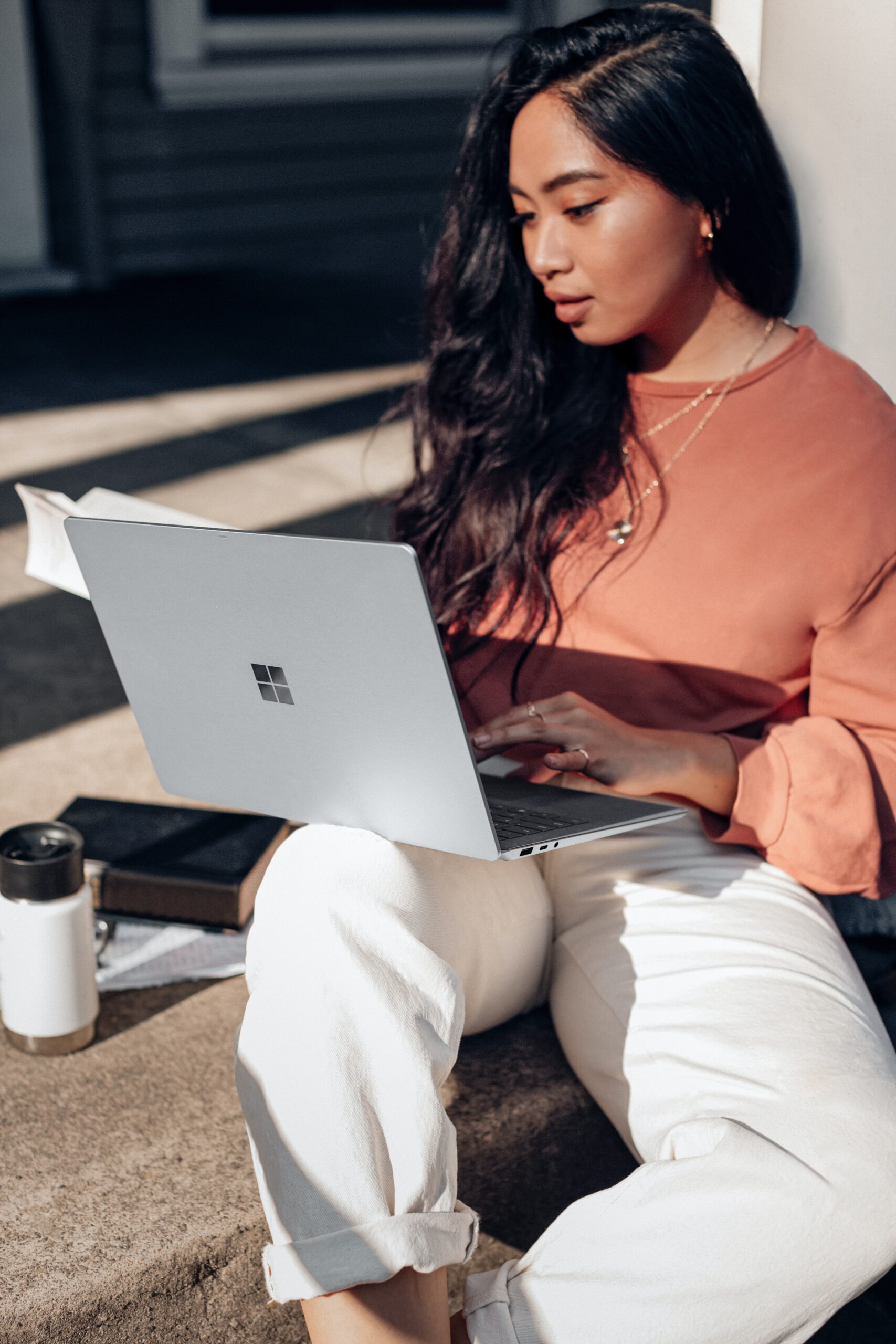 photo of woman studying on laptop